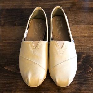 TOMS light yellow slip ons